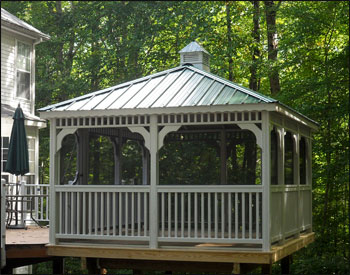 10 x 16 Treated Pine Rectangle Gazebo shown with Optional White Paint, Screens and Screen Door, Evergreen Metal Roof, and Cupola