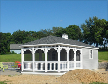12 x 20 Vinyl Pool House shown in White Vinyl Siding with 30 Year Architectural Virginia Slate Asphalt Shingles, Gray Composite Deck, Shutters, Full Set of Screens, Cupola and Screened Door. 