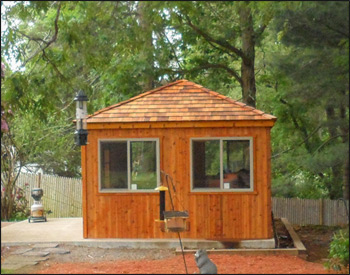 12 x 12 Cedar Rectangle Cabana shown with Plywood Floor, 60" 15-Lite Cedar French Doors, Four 40" x 46" Insulated Horizontal Sliding Window, Cedar Shake Shingles, Dome Skylight, 2 coats of Cedar Stain/Sealer, and Electrical Package. 