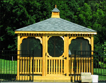 12 x 12 Treated Pine Rectangular Gazebo shown with full set of screens and screen door, cedar tone stain/sealer, and customer supplied shingles.  