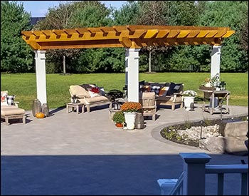 12 x 16 Rough Cut Oasis Pergola shown with Clear Stain/Sealer, Stainless Steel Hardware, 16" Top Runner Spacing, and Customer Supplied Lighting Kit.