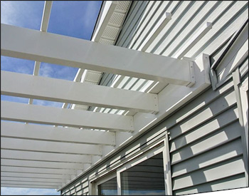 14 x 14 Vinyl 2-Beam Wall Mount Pergola shown with No Deck, 6" Round Fluted Columns, 12" Top Runner Spacing, Stainless Steel hardware, and Rush Delivery.  Wall Mount Detail Shown