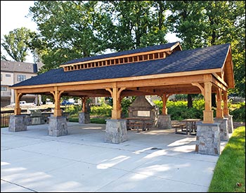 20 x 40 Alpine Heritage shown with Double Roof, 7 x 7 Posts, Clear Sealer, and Rustic Black Asphalt shingles. Stonework by 3rd Party.