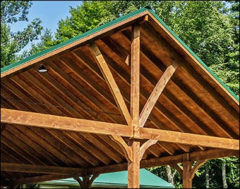 24 x 62 Grand Ridge Retreat shown with 10 tall 7"x7" posts, Evergreen Metal Roof, Short Post Trim, and Decorative Beam End Cut.