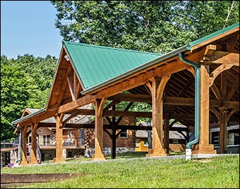 24 x 62 Grand Ridge Retreat shown with 10 tall 7"x7" posts, Evergreen Metal Roof, Short Post Trim, and Decorative Beam End Cut.