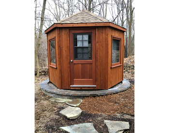 10 Cedar Hexagon Cabana shown with Customers Casement windows, Rustic Cedar Asphalt Shingles, and Cedar Tone Stain/Sealer.