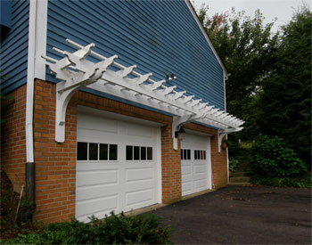 Custom Treated Pine 26 x 3 Wall Mounted Pergola shown with white paint.