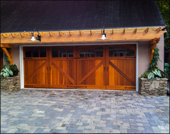 4 x 36 Red Cedar Eyebrow Pergola shown with custom 4 wall brackets, 2x8 spliced header beams, 2x6 runners (16" on center), 1x1 top runners (16" on center), and customer supplied stain. 