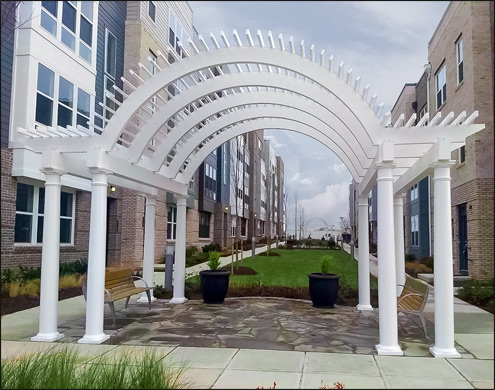 Custom 12x19 Arched Vinyl Pergola Shown with 10" White Vinyl Tapered Columns, 4 sets of Double Beams, Vinyl Top Runners, and Arched beam with Azek Wrap.