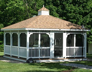16x16 Vinyl Rectangle Single Roof Gazebo shown with Cedar Composite Decking, 4 Track Window System with Screens, and Rustic Cedar Asphalt Shingles 