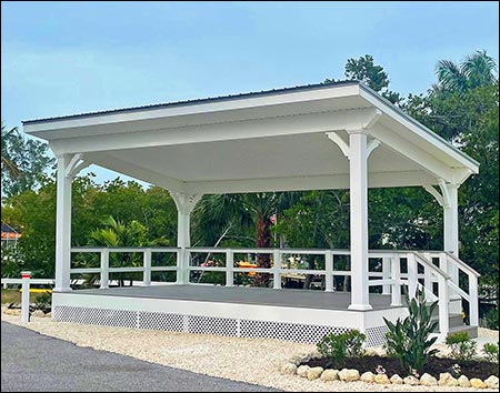 12' x 24' Vinyl Santa Barbara Pergola shown with White Vinyl, Gray Metal Roof, 8"x8" Vinyl Posts, Harbor Grey Composite Deck, Vinyl Finished Ceiling, and custom vinyl railing.