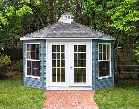 10' x 16' Oval Sunroom shown with Slate Blue Vinyl Siding, Oxford Gray Asphalt Shingles, and Glass Double Doors.